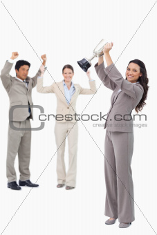 Successful tradeswoman holding cup