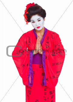 Portrait of geisha with hands together respect gesture isolated on white