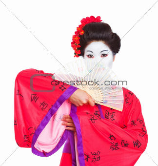 Portrait of geisha hiding behind fan isolated on white