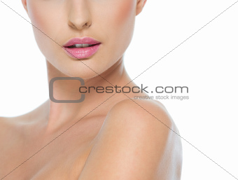 Closeup on female neck and lips isolated on white