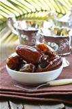 sweet dates in  bowl on a natural background