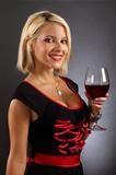 Sexy blond drinking red wine