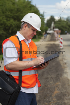Engineer near the road repair work