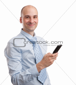 Young smiling businessman with mobile phone
