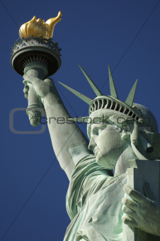 Close-up Portrait of Statue of Liberty Bright Blue Sky