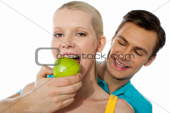 Love couple. Girlfriend eating an apple