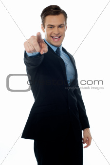Smiling young professional pointing at you