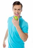 Handsome young caucasian biting an apple