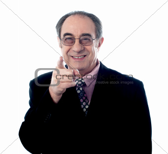 Elder executive pointing at you