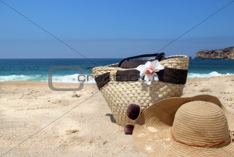Seacoast, straw beach bag, hat and sunglasses 