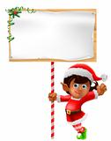 Christmas elf holding a sign