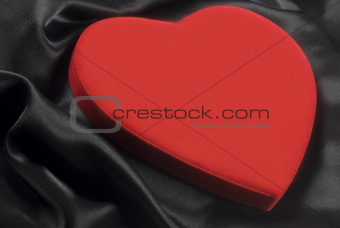 Red heart on silky wavy fabric