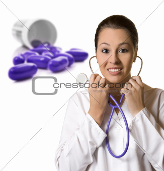 Young female doctor with pills in the background