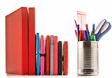 Stationery and books on white background