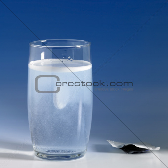 fizzy tablet in a glass of water