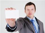 Young businessman with a business card