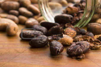 Cocoa (cacao) beans on natural wooden table