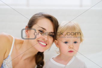 Portrait of young mother and baby