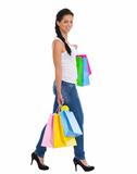 Full length portrait of smiling girl with shopping bags