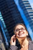 Woman or Businesswoman Talking on Cell Phone in City