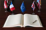 Open spread book, fountain pen, EU (European Union) flags
