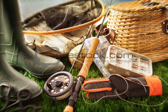Fly fishing equipment on grass