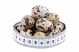quail eggs and measuring tape