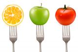 Lemon, tomato and apple on forks  Concept of diet