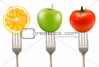 Lemon, tomato and apple on forks  Concept of diet