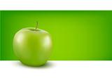 Green apple in front of green background