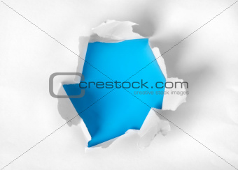 Paper torn with blue background