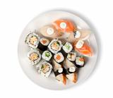 Sushi and rolls in a plate isolated
