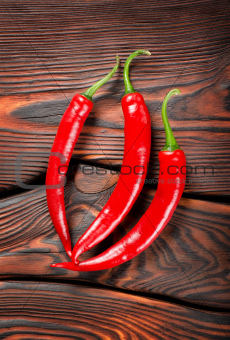 Three red chili peppers