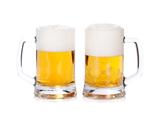 Two beer mugs isolated on a white background