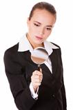 Attentive business woman with loupe