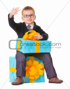 Small boy in spectecles with big present