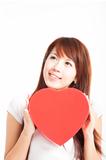 young woman holding red heart gift box