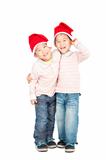  happy asian kids with Christmas hats