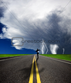 businessman running to the storm on the road