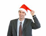 Portrait of smiling businessman playing with Santa's hat