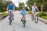 Young Family Parents and Boy Son Cycling
