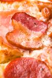 Italian pizza with bacon, salami and mozzarella cheese