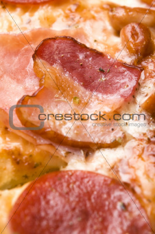 Italian pizza with bacon, salami and mozzarella cheese