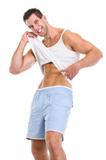 Happy man pointing on abdominal muscles