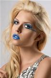 blonde girl with euro flag make-up, she is turned of three quart