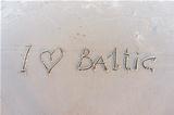 I love Baltic. Inscription on white sand of Baltic beach.