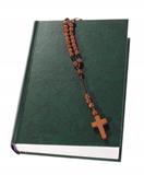 Wooden rosary on the Bible