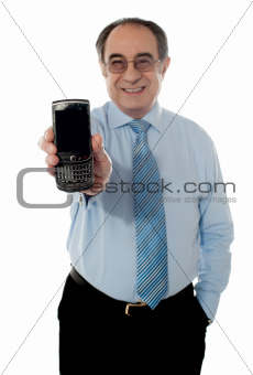 Senior sales manager promoting a cel phone