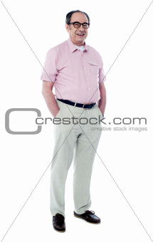 Joyful senior man posing casually