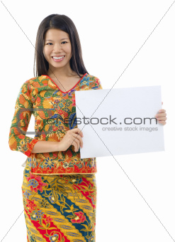 Asian woman holding placard